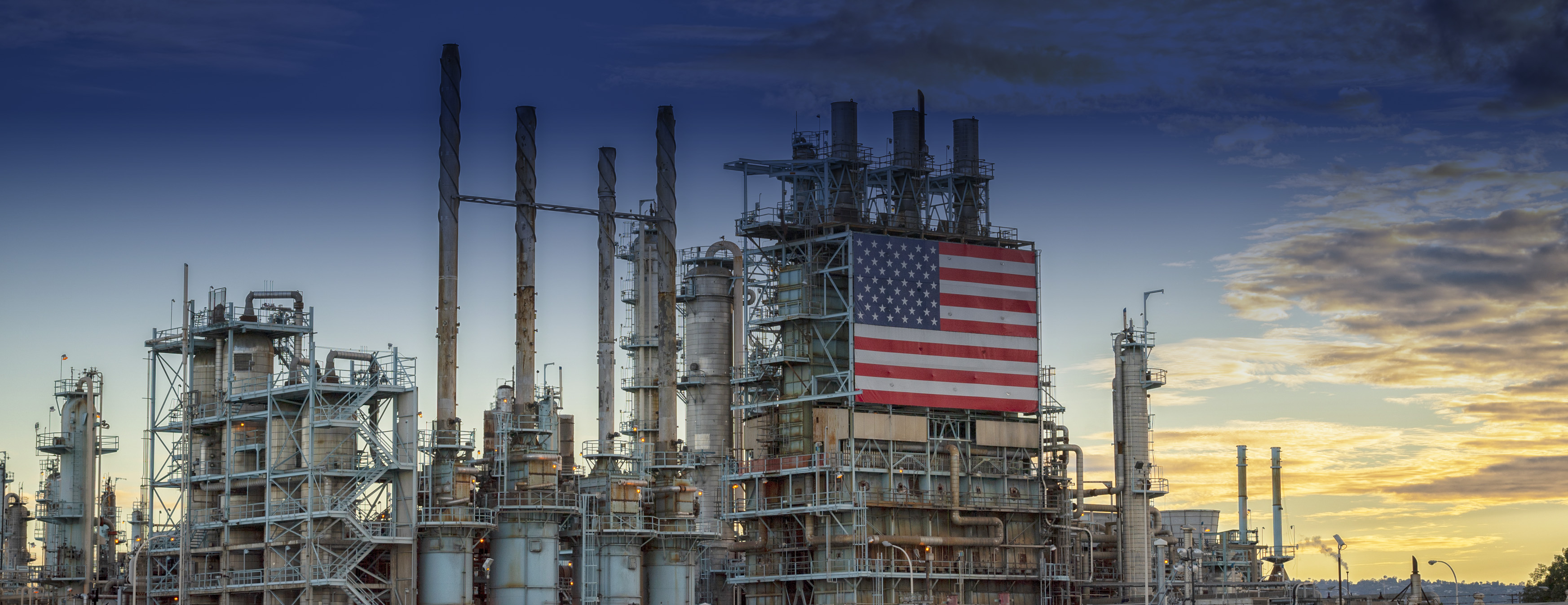 Marathon Petroleum employees turning valves and smiling at camera
